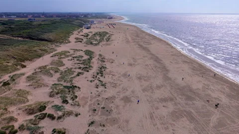 High angle horizontal aerial drone video clip of sandy beach, North Sea Stockbeeldmateriaal 342663041