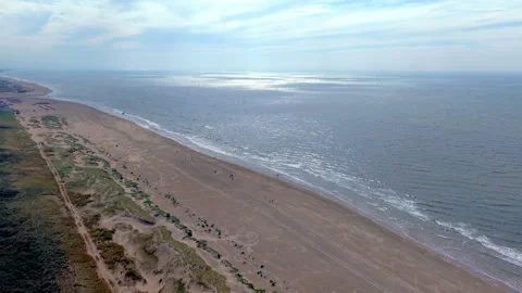 High angle horizontal aerial drone video clip of sandy beach, North Sea Stockbeeldmateriaal 342667410
