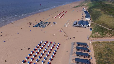 High angle horizontal aerial drone video clip of beach pavilion, sunlounger Video stock 342667512
