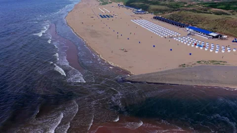 High angle horizontal aerial drone video clip of beach outlet stream North Video stock 342737169