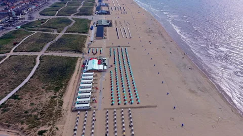 High angle horizontal aerial drone video clip of beach cabins, coloured 動画素材 342737820