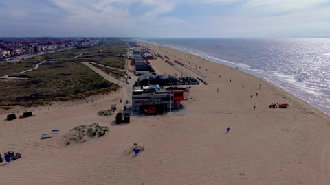 High angle horizontal aerial drone video clip of beach rescue station Stock Footage 342737857