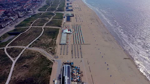 High angle horizontal aerial drone video clip of beach pavilion, colourful Видео 342737923
