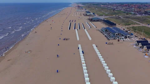 High angle horizontal aerial drone video clip of beach cabins resort pavilion Видео 342739938