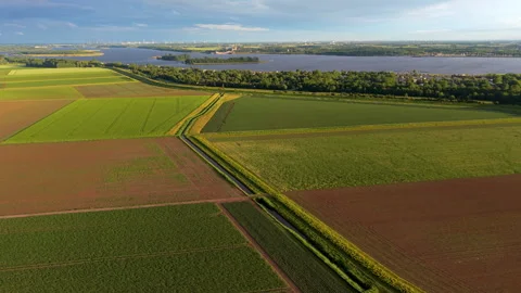 High angle horizontal aerial drone video clip of agricultural fields Stockbeeldmateriaal 342764906