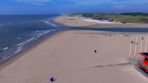 High angle horizontal aerial drone video clip of beach rescue station Katwijk Stockbeeldmateriaal 342819154