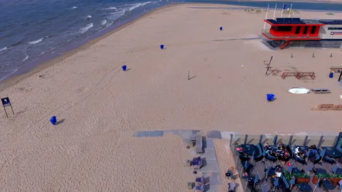 High angle horizontal aerial drone video clip of beach pavilion terrace Stockbeeldmateriaal 342819725