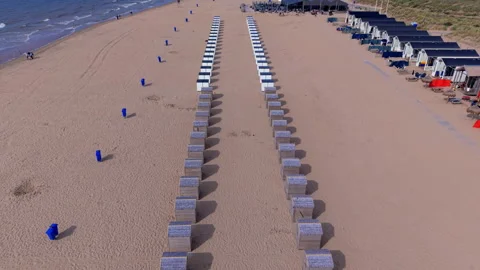 High angle horizontal aerial drone video clip of beach cabins, wooden huts Vídeos de archivo 342819727
