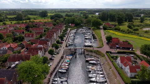 High angle horizontal aerial drone video clip of harbor, boats, drawbridge Vídeos de archivo 342992734