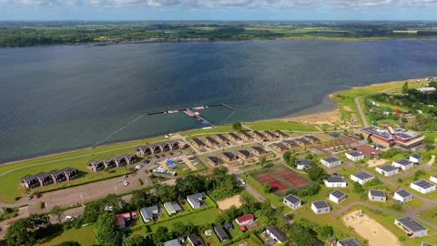 High angle horizontal aerial drone video clip of holiday park, chalets Vídeos de archivo 342992752