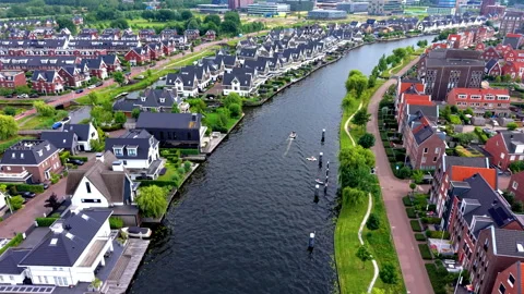 High angle horizontal aerial drone video clip of river canal, motorboats Vídeos de archivo 342995622