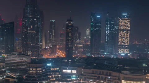 High angle Illuminated city skyline timelapse night Downtown Dubai aerial shot Stock Footage 337945885