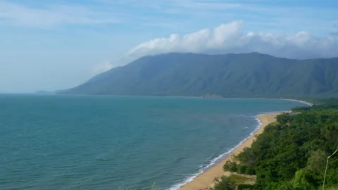 High Angle Land-Based Aerial View of Tropical Peninsula and Sky Blue Ocean Stock Footage 314933699