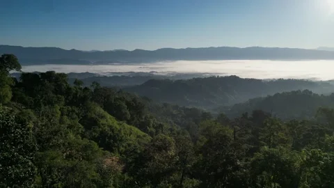 High angle landscape view of misty mountain range with thick white fog unde.. Video stock 345652940