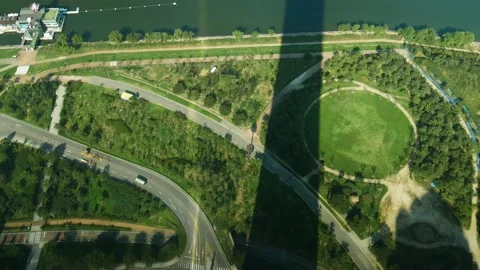 High angle look down tower green park single car move Stock Footage 233479212