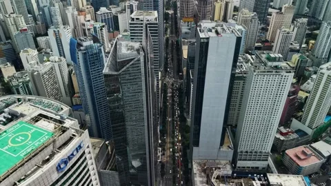 High Angle Makati Skyline with Central Urban Traffic Axis Stock Footage 330874552