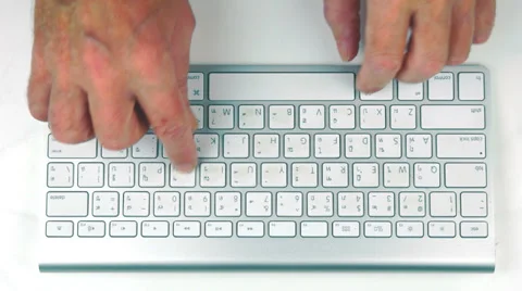 High angle of male hands typing on a keyboard. Vídeos de archivo 35919520