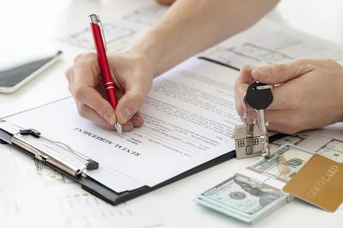 High angle man signing contract new home Resolution and high quality beautiful Stock Photos