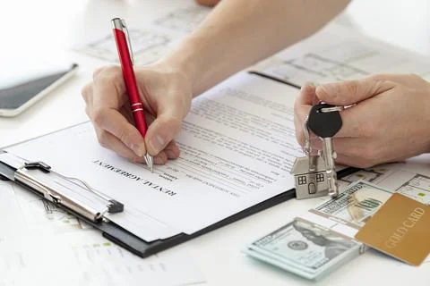 High angle man signing contract new home. High quality beautiful photo concep Stock Photos