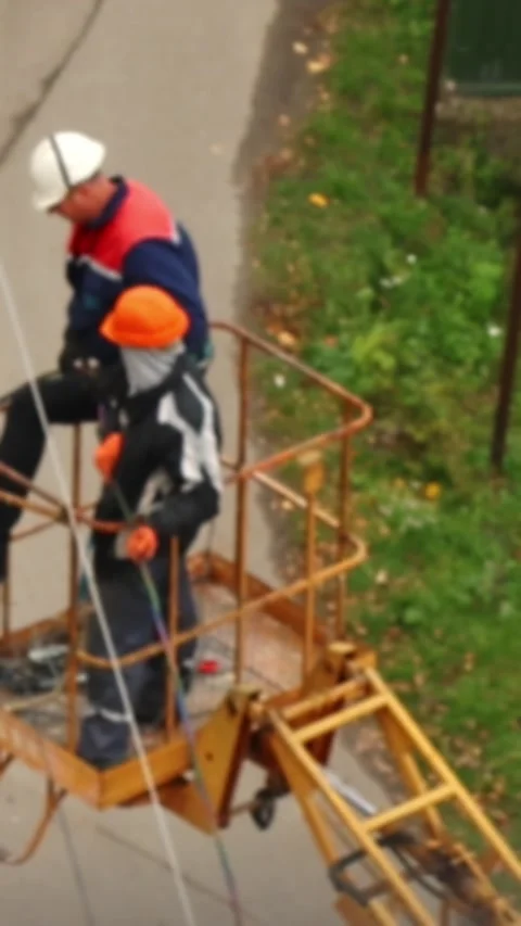 High-angle medium shot of two construction workers in high-visibility jacke.. Stock Footage 343532328