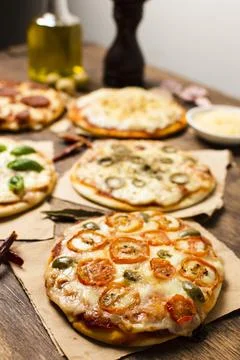 High angle mini pizza wood table Stock Photos