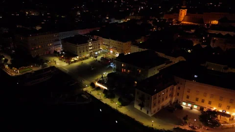 High angle night aerial arc shot of Gmunden city and historical center, Austria Stock Footage 331215516