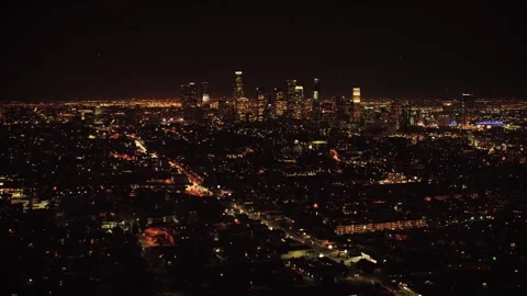 High angle night drone shot over Los Angeles with glowing avenues Stock Footage 344389975