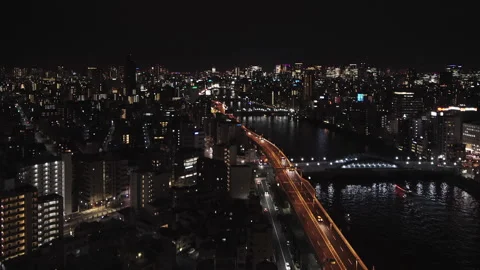 High angle night video of the Sumida river and the tokyo highway. Stock Footage 125638014