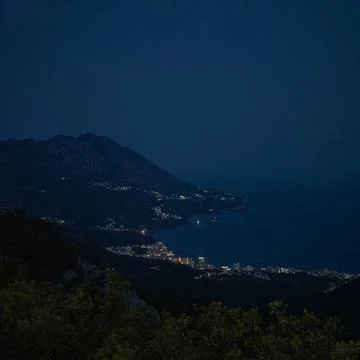 High-angle night view of the Budva Riviera coastline in Montenegro Stock Photos
