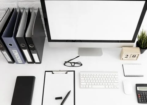 High angle office desk with computer screen clipboard Stock Photos
