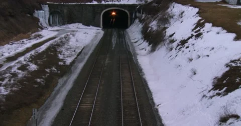 High angle over a passenger train going through a tunnel in the winter. Stockbeeldmateriaal 41630109