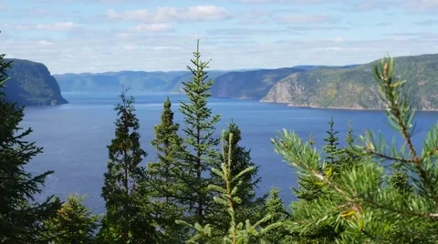 High angle overlooking large body of water and mountains in the background Vídeos de archivo 62651612