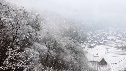 High angle pan shot of Historical Village of Shirakawa-go on snowy day in winter Stock-Footage 113347753