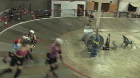 High angle pan of skaters during training, Texas Roller Derby Video stock 232957897