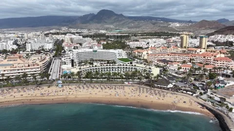 High angle Panning drone aerial Playa de las Americas Tenerife Spain Stock Footage 330986934