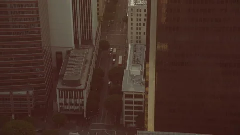 High angle panning shot up long street in city Stock Footage 145938165