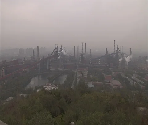 High angle panorama of multiple coal burning power plants with smoke and haze Stock Footage 86744467