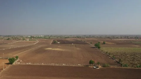 High-angle panoramic aerial view capturing structured grids of various brown Vídeos de archivo 336902152