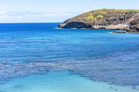 High angle panoramic overlook of the vibrant turquoise ocean water at Hanau.. Stock Photos