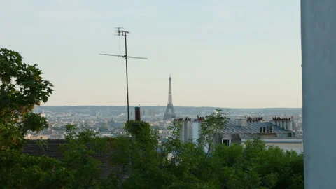 High-angle panoramic view across the rooftops of Paris looking toward the iconic Stock Footage 337414085