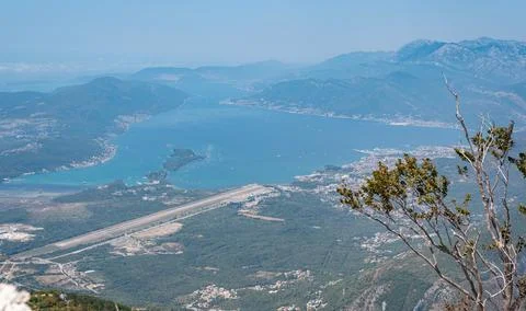 High-angle panoramic view of the Bay of Kotor and Tivat Airport runway Stock Photos