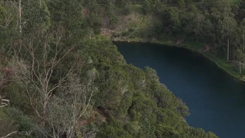 High angle panoramic view of blue lake in extinct volcano crater Stock Footage 339377007