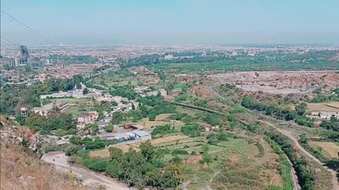 High Angle Panoramic View of Industrial Landscape and Urban Greenery Stock Footage 333542813
