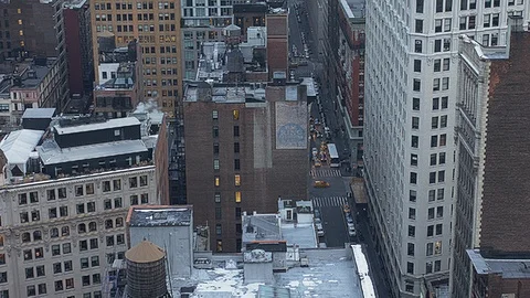 High angle panoramic View over Manhattan streets from Skyscraper Rooftop at dawn Stock Footage 92578540