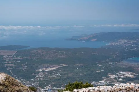 High-angle panoramic view overlooking a coastal valley and a blue bay Stock Photos
