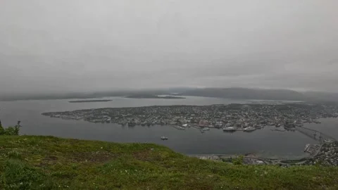 High angle panoramic view of Tromso island and fjord with boat from Storsteinen Stock-Footage 341697313