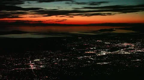 High Angle PanR at Night/Twilight over Great Salt Lake and Distant City Lights Stock Footage 12290514