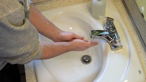High angle of a person demonstrating the modern hand washing routine. Video stock 138654671