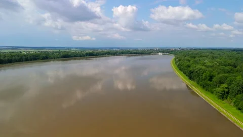 High angle perspective of brown floodwater at Faiminger Stausee. Surface covered Stock Footage 327751392