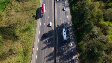 High-Angle Perspective of Commuter Vehicles and Freight Trucks on Dual Stock Footage 343913172